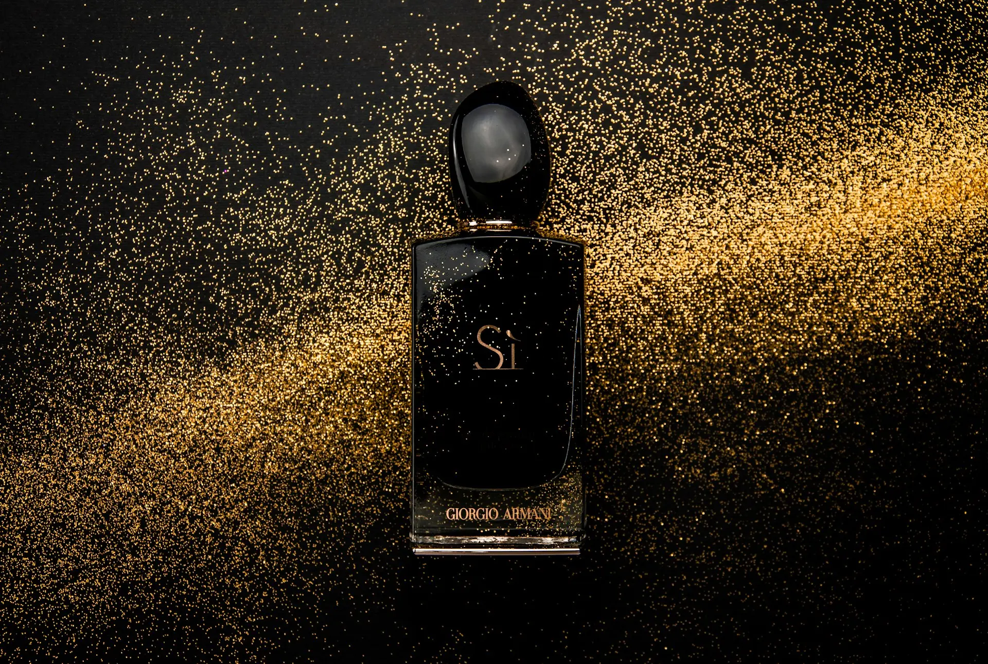 black glass perfume bottle showing front label